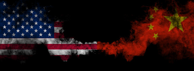 American and Chinese flags in smoke shape on black background. Concept of conflict war and customs...