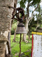 Fototapeta premium Temple bell at Sri Kariya ramar temple located in the small town of Valavandhi near the popular hill station Yercaud, Tamil Nadu