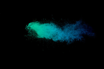 Blue and green explosion of powdery dust