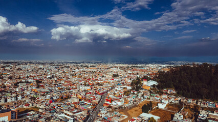Aerial photography of the Nevado de Toluca landscape at sunset, with snow, clouds and a sky with...