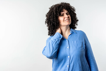 Woman rubbing her painful neck and back.