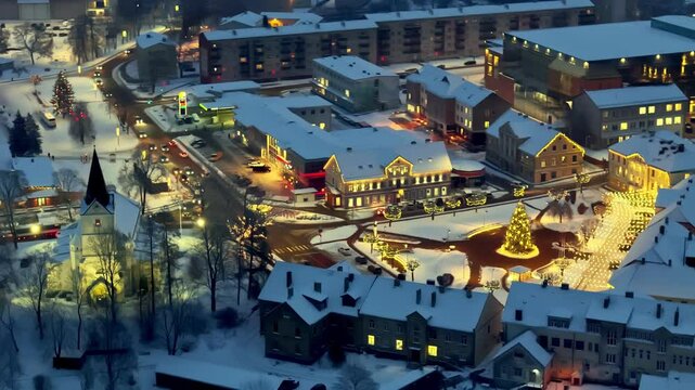 Aerial view featuring Saldus town decorated with lights prior to Christmas in Latvia. Night shot.