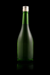 Green glass wine bottle with a reflective black background