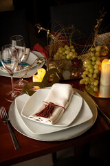 Elegant New Year's Eve Table with Empty Dishes, Candles, and Golden Festive Decorations