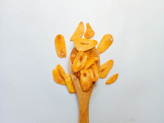 Fried garlic chips or slice on wooden spoon. Use as condiment topping in various Indonesian...