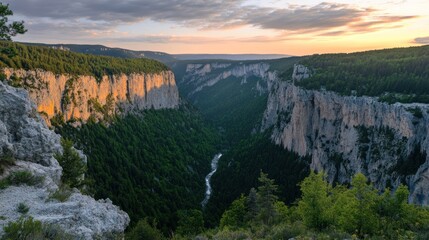 Majestic Sunset Over Verdant Gorge And Cliff Walls