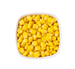 White ceramic bowl of sweet corn kernels isolated on white background, top view.