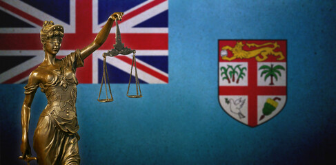 Lady Justice before a flag of Fiji