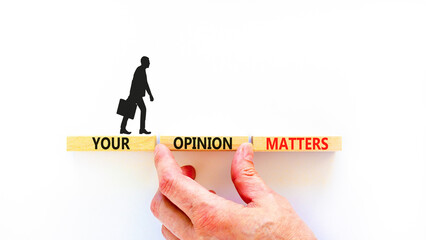 Your opinion matters symbol. Concept words Your opinion matters on beautiful wooden blocks. Beautiful white background. Businessman hand. Business your opinion matters concept. Copy space.