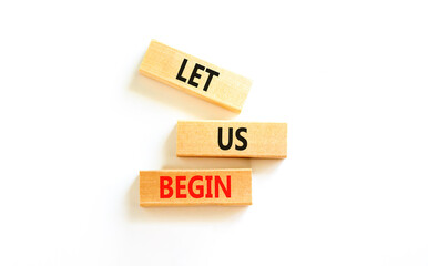 Let us begin symbol. Concept words Let us begin on beautiful wooden blocks. Beautiful white table...