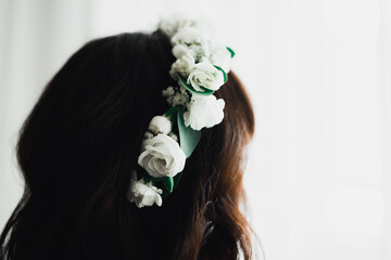 Luxury bride in white dress posing while preparing for the wedding ceremony