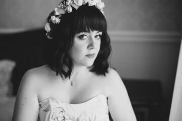 Portrait of beautiful bride with fashion veil at wedding morning