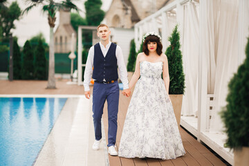 Wedding couple holding hands, groom and bride together on wedding day