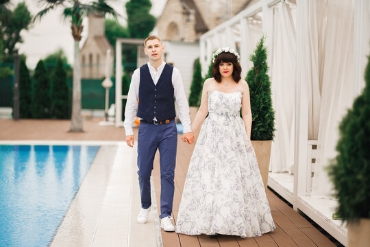 Wedding couple holding hands, groom and bride together on wedding day