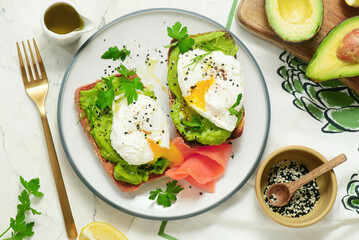 Whole grain toast with avocado and poached egg. for breakfast  .Healthy appetizer.