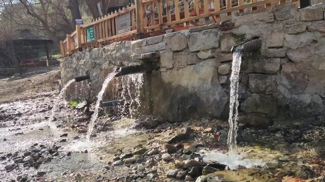 Water fountain troughs, carved from a tree trunk, used for drinking water in the Dokuzoluk Recreation Area of the Taurus Mountains.