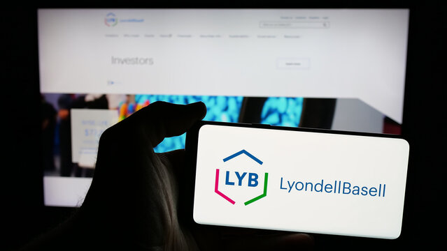 Stuttgart, Germany - 01-24-2025: Person holding mobile phone with logo of chemical company LyondellBasell Industries NV on screen in front of web page. Focus on phone display.