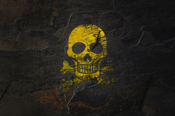 Radiation symbol skull on grunge wall.