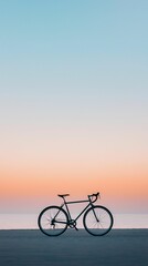 Obraz premium A lone bicycle frame against a clear sky, only the outline of the bike visible with a soft gradient background, emphasizing simplicity