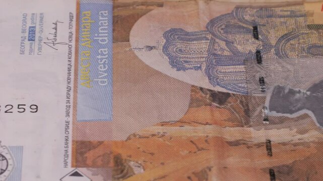 A heap of Serbian dinar paper currency, 1000, 2000 and 5000 dinars value. Serbian money as backgrounds.