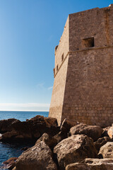 DUBROVNIK, Croatia The defensive walls of the old city of Dubrovnik. View of the tower, stone promenade in the foreground. Clouse up