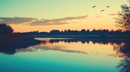 Obraz premium Serene Sunset Over Calm Lake With Birds Flying