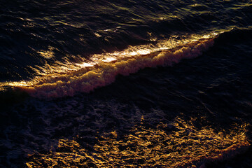 Photos of sea waves moving at sunset