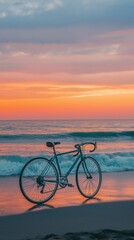Obraz premium Road bike resting on a sandy beach near gentle waves, with the orange and pink hues of a sunset casting a warm glow over the serene coastal landscape