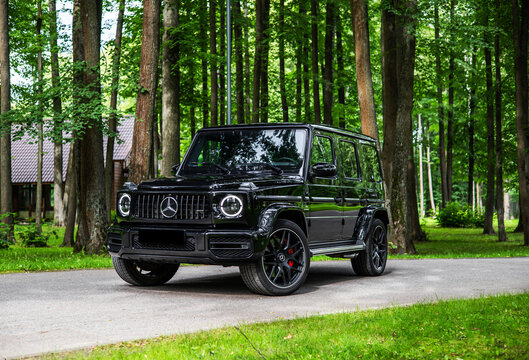 car in the woods forest Mercedes-Benz AMG G63 G-Class a true cross-country vehicle off-road logo detail
