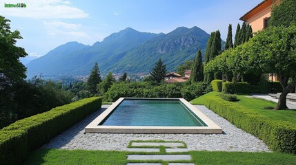 Relaxing rectangular pool surrounded by lush landscaping and mountains
