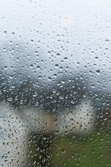 Raindrops on the glass in the window. Wet window after rain. Rain outside the window.