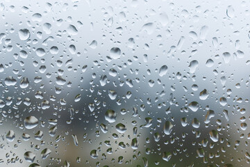 Raindrops on the glass in the window. Wet window after rain. Rain outside the window.