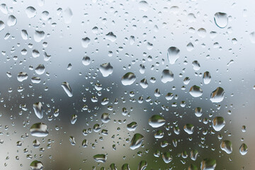 Raindrops on the glass in the window. Wet window after rain. Rain outside the window.