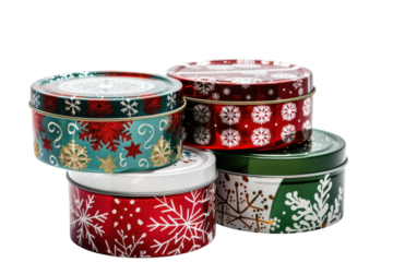 Colorful holiday tins arranged in a stack, showcasing festive designs of snowflakes and stars against a clean white background isolated on transparent background