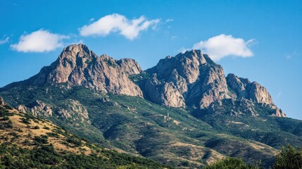 Naklejka premium Majestic Mountain Range Under a Clear Blue Sky