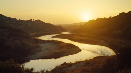 Serene Sunset River Winding Through Golden Hills