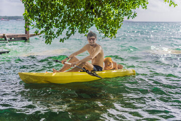 Father and son tourists kayaking on Bacalar Lake in Mexico. Adventure tourism in Quintana Roo, outdoor exploration, and water activities concept