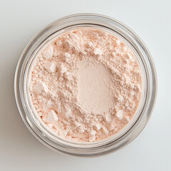 Loose powder in a round transparent container.