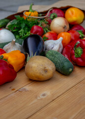 Fresh Organic Vegetables in Paper Bag on Wooden Background