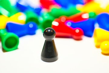 Pawns of different colors representing the concept of diversity, selectively focusing on a black...