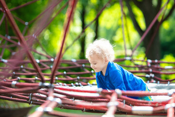 Obraz premium Child having fun on school yard playground