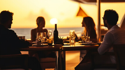 Silhouettes of people dining on a yacht deck during twilight over the ocean