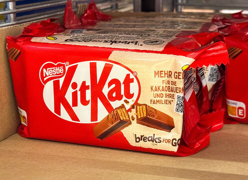 Nestle kitkat chocolate pack with german text displayed in store shelf