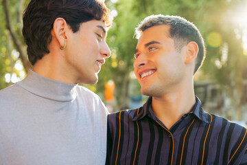Fototapeta premium gay couple of young latin men happy looking into each other's eyes in love, gen z