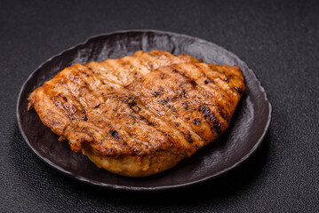 Delicious fresh grilled chicken fillet with spices and herbs