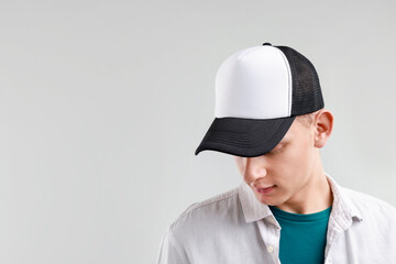 Man in stylish baseball cap on light grey background. Mockup for design