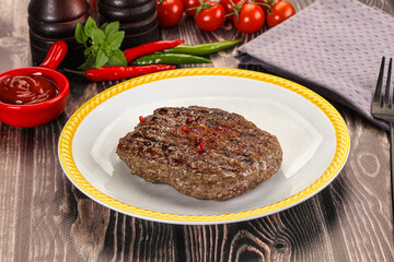 Grilled beef burger cutlet with sauce