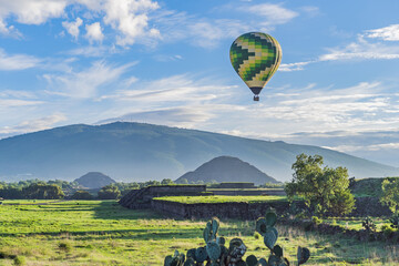 An aerial view of hot air balloons above the Teotihuacan pyramid. Adventure travel, cultural heritage, and aerial exploration concept