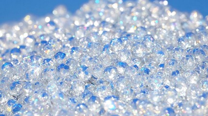 Fototapeta premium Sparkling clear round beads with iridescent sheen in bright sunlight