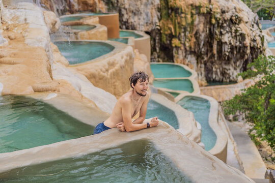 Male tourist at the hot springs of Grutas Tolantongo, Mexico. Adventure, relaxation, and natural wellness concept